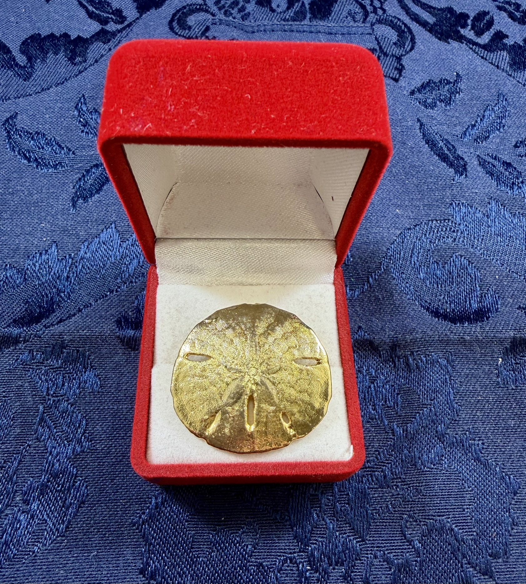 Gold Colored Sand Dollar · Lot 1212