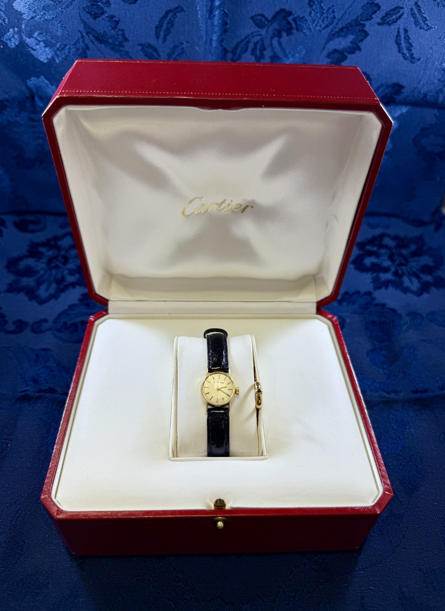 18K Ladies Cartier Wristwatch with Black Band · Lot 1651